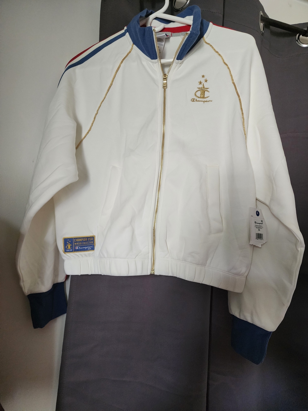 Champion White Jacket with Navy Trim and Red Accent Tag